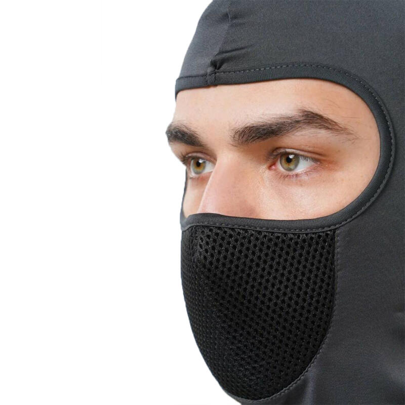 A person is wearing a grey balaclava with a black mesh covering the nose and mouth area, looking to the left.