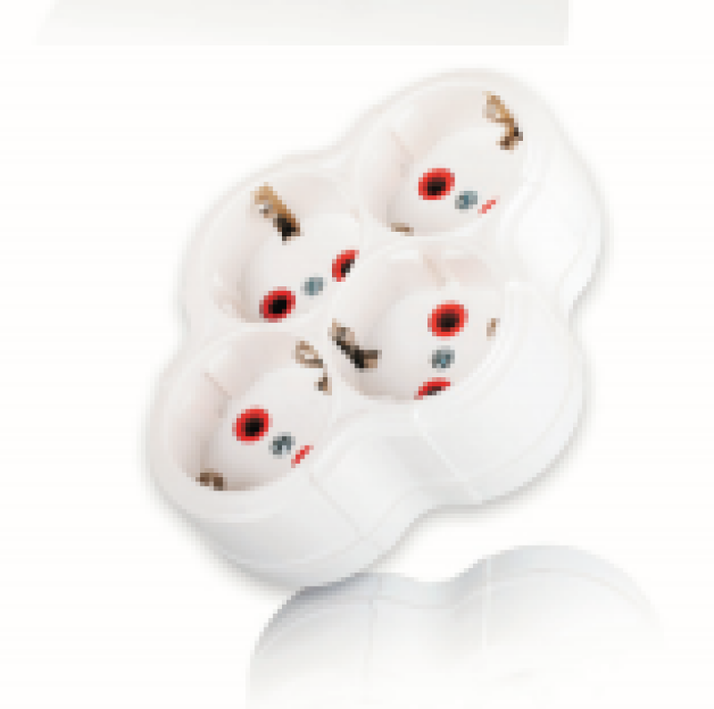 A white four-socket power adapter is on a white surface.