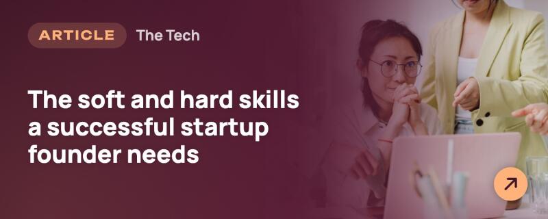 A dark reddish-purple overlay with white text "ARTICLE", "The Tech", and "The soft and hard skills a successful startup founder needs" covers the left side. On the right, two women are seen, one wearing glasses and looking at a pink laptop, while another in a light yellow blazer points at the screen, with an orange circle and arrow visible on the laptop.
