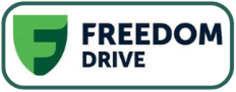 The logo features a green shield with a stylized letter 'F' and the words 'FREEDOM DRIVE' in dark blue, all within a white rounded rectangle with a green border.