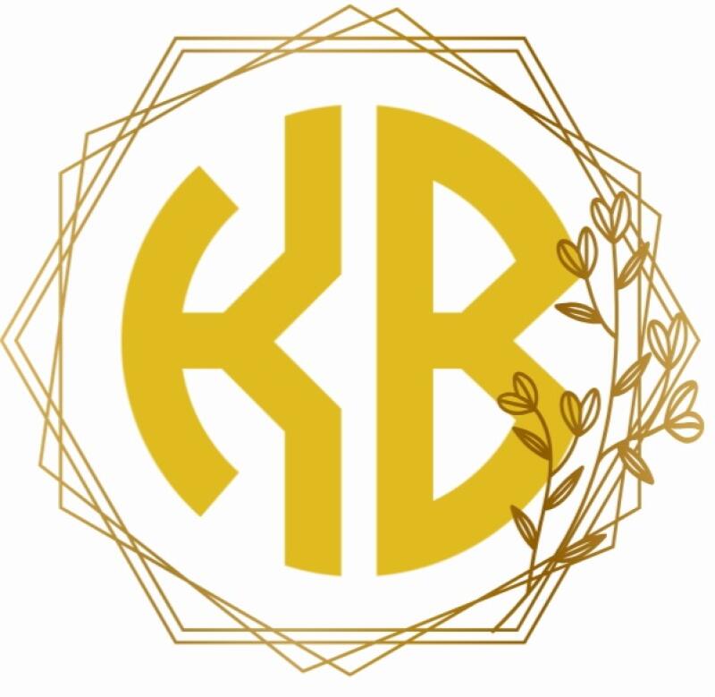 The image features a gold-colored monogram of the letters 'KB' inside a white circle, surrounded by a gold geometric frame and floral accents.