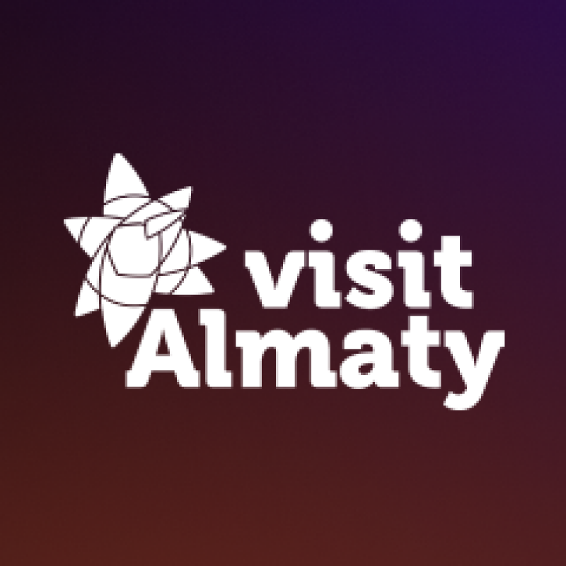 The image features the "visit Almaty" logo in white against a gradient dark purple to brown background, with a stylized flower-like graphic to the left.