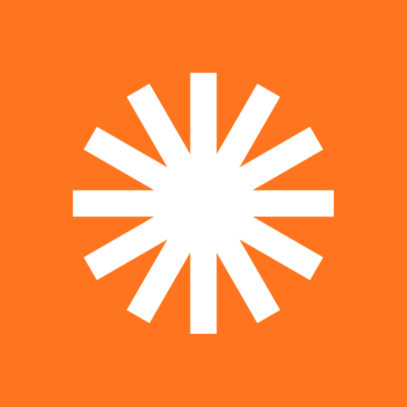 The image features a white, star-like design with twelve points, set against an orange background.
