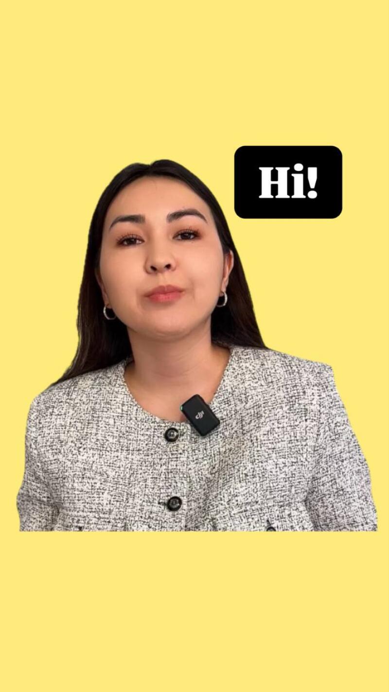 A woman with dark hair and fair skin is wearing a tweed jacket and a lavalier microphone. The background is yellow and the text "Hi!" is in a black box.