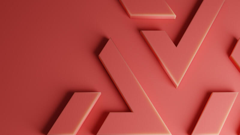 The image shows a salmon-colored background with a pattern of abstract geometric shapes. The shapes appear to be three-dimensional and slightly raised from the surface.