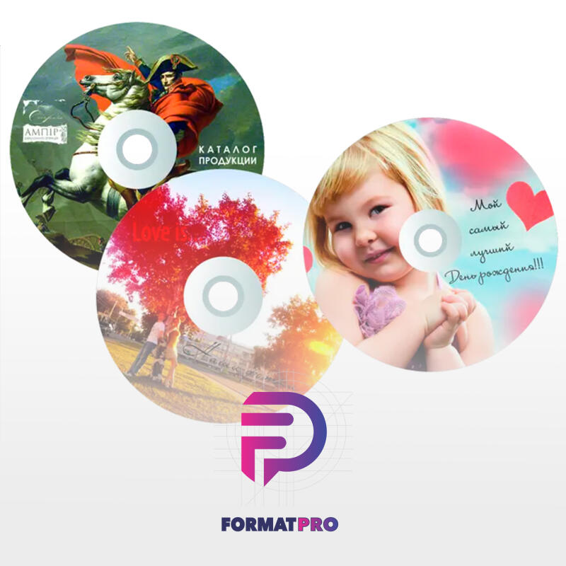 The image showcases three decorative CDs, each featuring different designs: a painting of Napoleon on horseback, a couple under a red-leaved tree with "Love is..." written above, and a child with the text "Мой самый лучший День рождения!!!" against a heart-filled background. The FORMATPRO logo is displayed at the bottom.