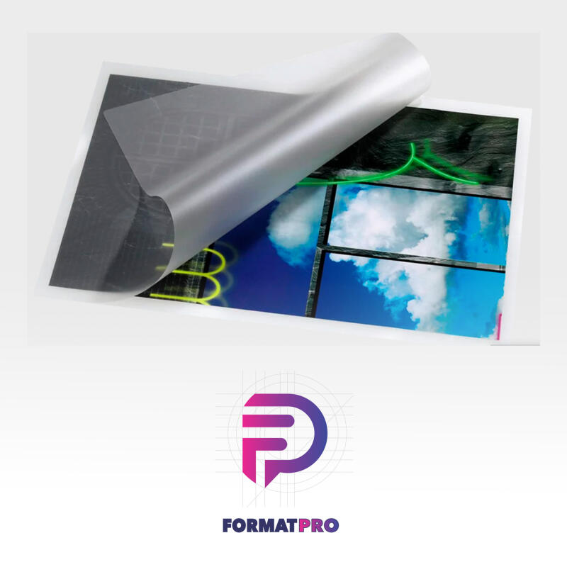 The image shows a laminated sheet with a design featuring a city skyline, a window view of clouds, and neon lights, with a protective layer being peeled back.