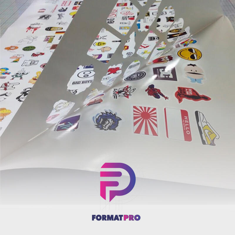 A sheet of assorted stickers is being peeled, revealing various designs including cartoon characters, logos like "BAD BOYS", and a name tag sticker with "HELLO" printed on it.