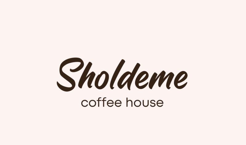The image features the logo for 'Sholdeme coffee house' in a dark brown, cursive font against a light beige background.