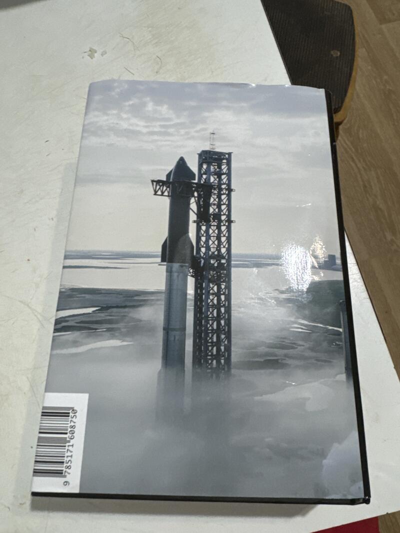 The image shows a book cover with a black and white photo of a Starship rocket next to a launch tower, with a bar code and the number '9 785171 608750' visible on the side.