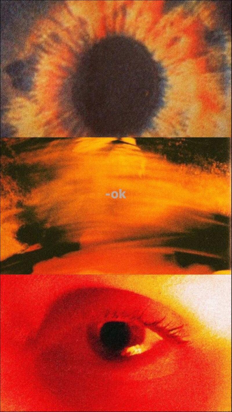 The image is a triptych featuring abstract and close-up views, with the text "-ok" visible in the center panel. The color palette is dominated by warm tones, including orange and red, with a grainy texture throughout.