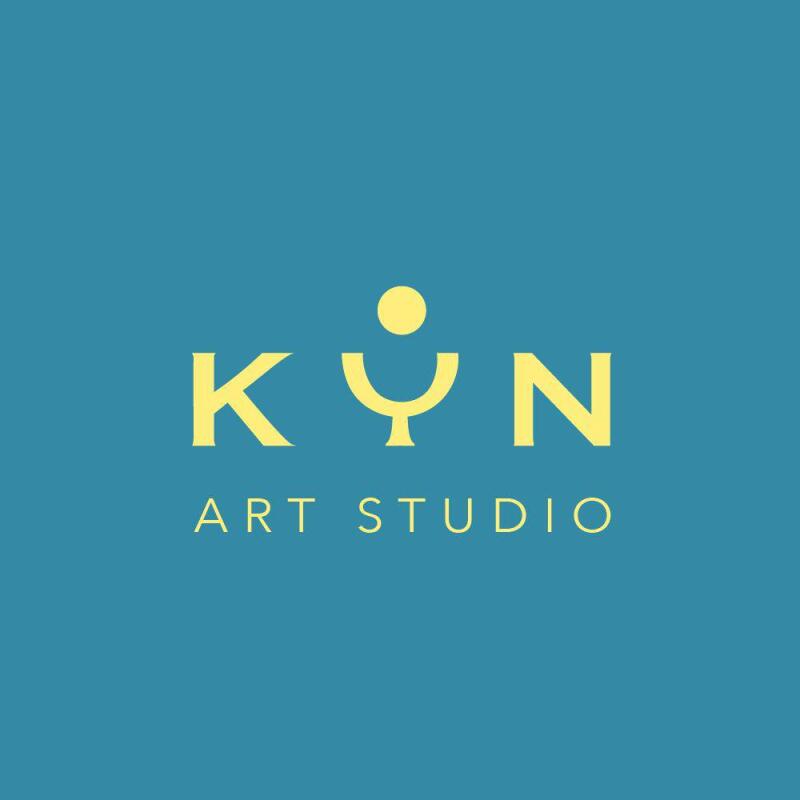 The image features the logo for "KÝN ART STUDIO" in yellow against a blue background.
