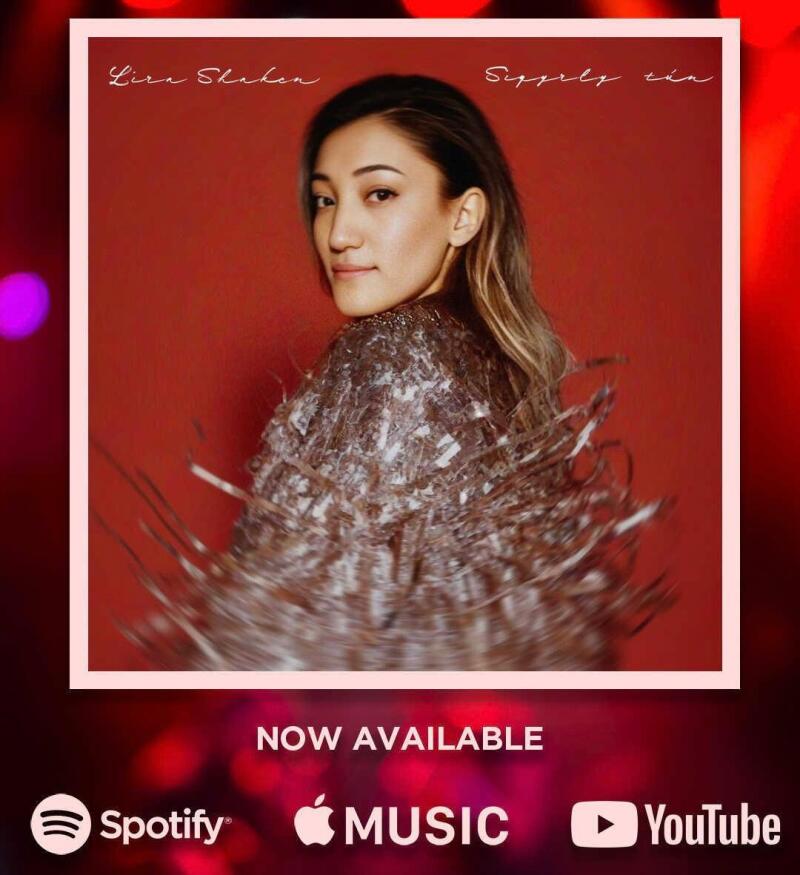 The image is an advertisement for Lizi Shahen's "Suppely tin," which is now available on Spotify, Apple Music, and YouTube. The ad features a photo of Lizi Shahen in front of a red background.