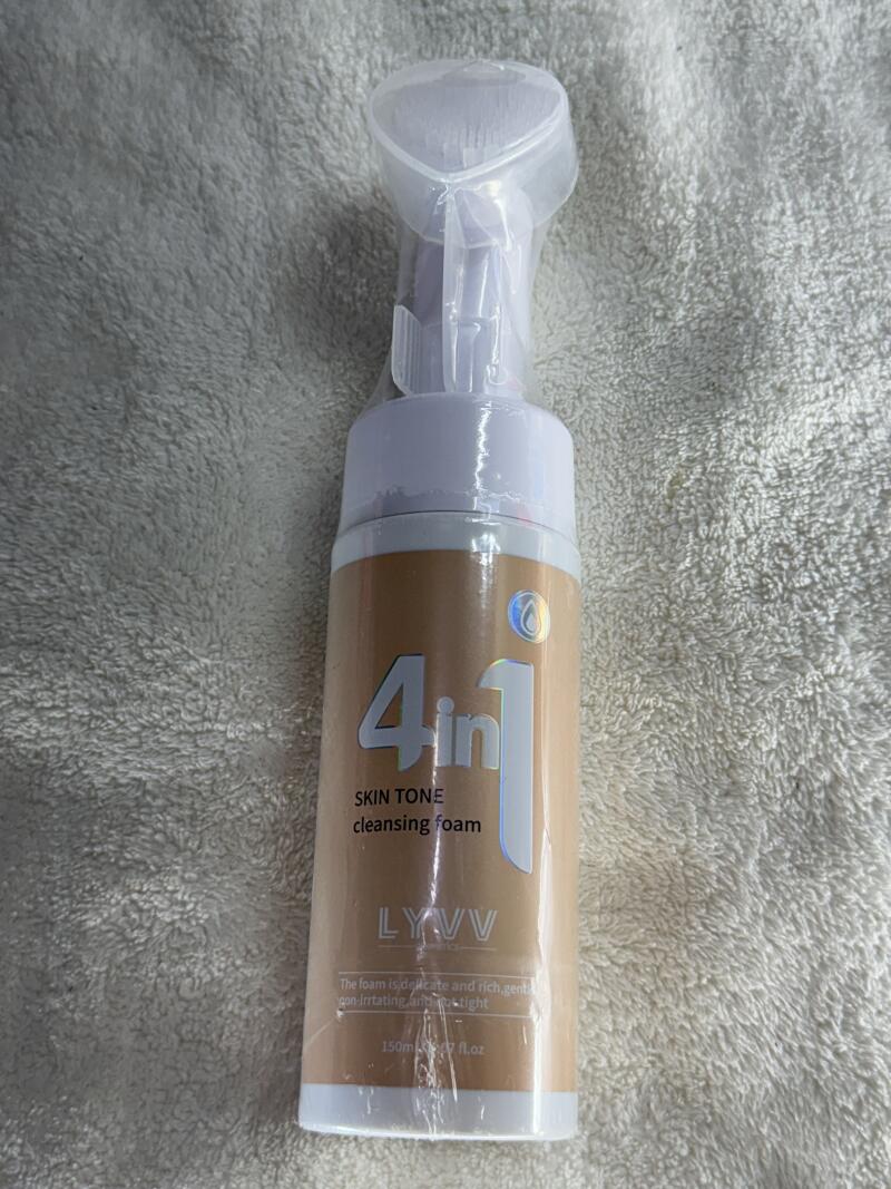 A bottle of 4 in 1 Skin Tone cleansing foam with a white pump and clear plastic cap, the label featuring the text 'LYVV', 'The foam is delicate and rich, gent' and '150ml / 5.1 fl.oz'.