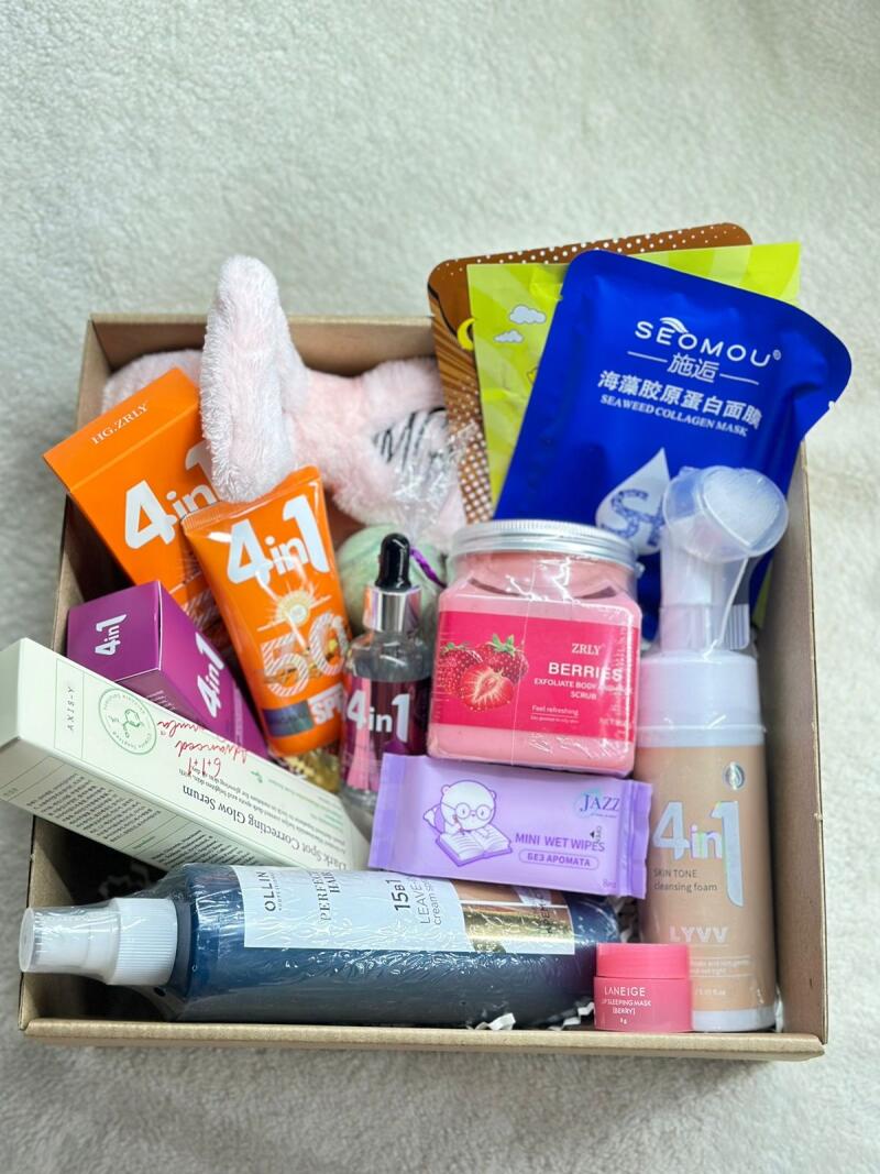 A box filled with various skincare products, including masks, serums, scrubs, wipes, and cleansing foam. Brands include SEOMOU, ZRLY, AXIS-Y, LANEIGE and OLLIN.
