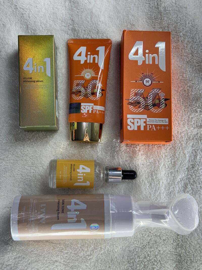The image displays a collection of 4in1 skincare products, including yellow whitening serum in a box and bottle, SPF 50 sunscreen in a tube and box, and skin tone cleansing foam.