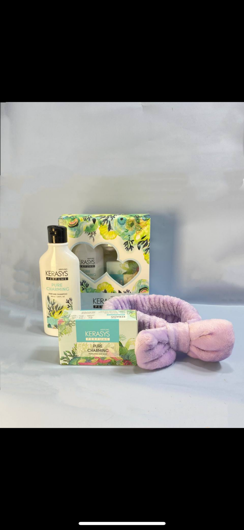 The image shows a Kerasys Pure Charming perfume gift set, which includes shampoo, bar soap, and a boxed set, along with a fluffy purple headband.
