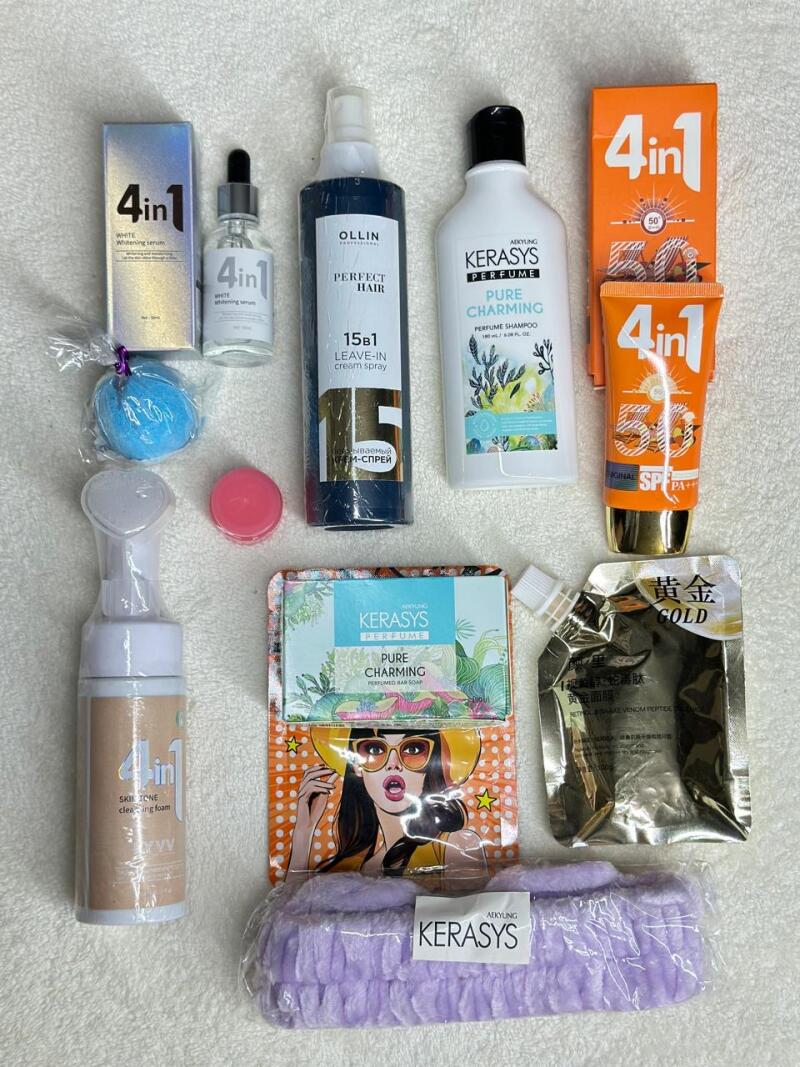 The image shows a collection of assorted beauty and personal care products, including serums, hair sprays, shampoos, sunscreens, soaps, and face masks from brands like 4in1, Ollin, and Kerasys.