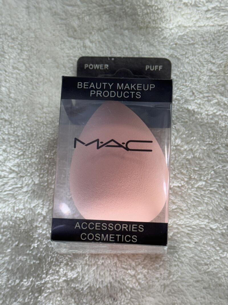 A packaged MAC brand makeup sponge is displayed, labeled 'Beauty Makeup Products' and 'Accessories Cosmetics'. The package also indicates 'Power Puff'.