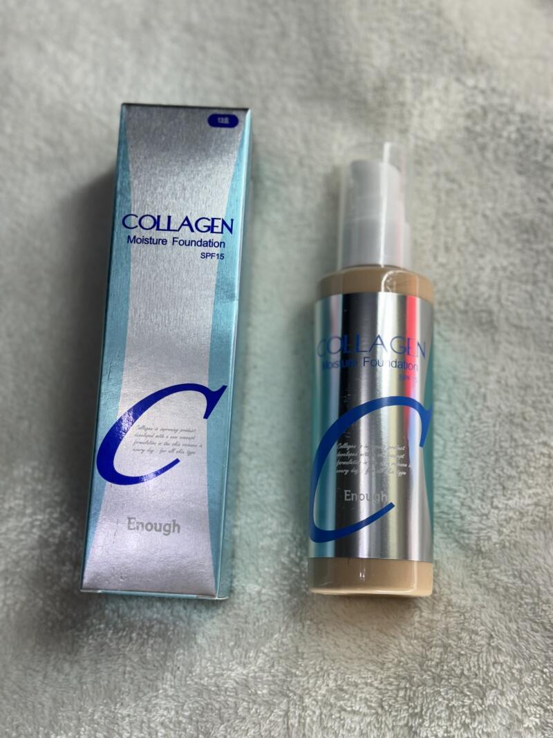 A box and bottle of Enough Collagen Moisture Foundation SPF15 are displayed, featuring a silver and light blue color scheme with a large blue 'C' logo.
