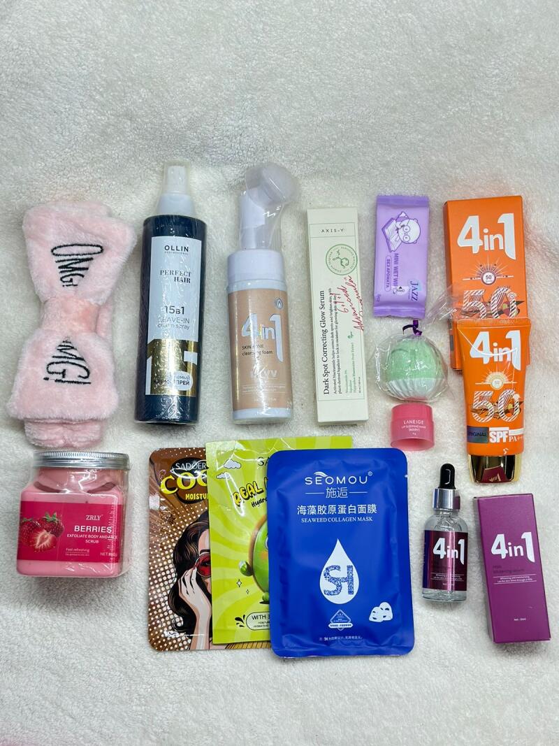 The image shows a collection of skincare and beauty products, including masks, serums, scrubs, and SPF, arranged on a white textured surface, along with a pink "OMG!" headband.