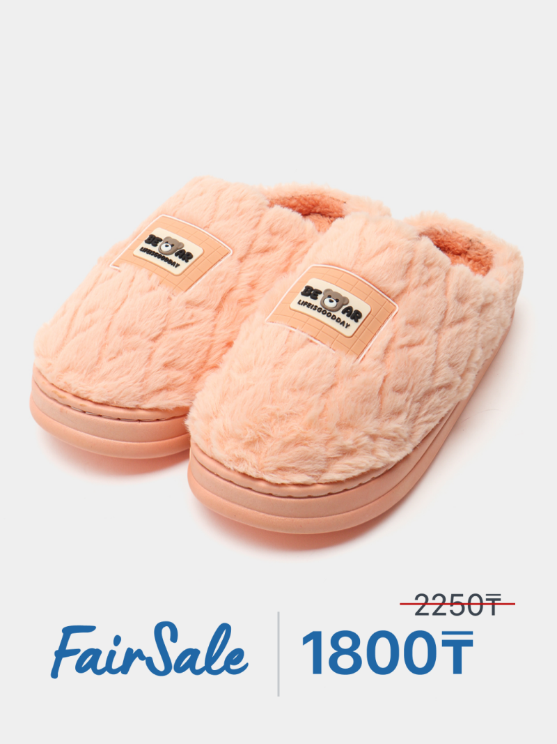 A pair of peach-colored, furry slippers with a logo that reads "BEAR LIFEISGOODDAY" are displayed, with a sale price of 1800₸ advertised below.