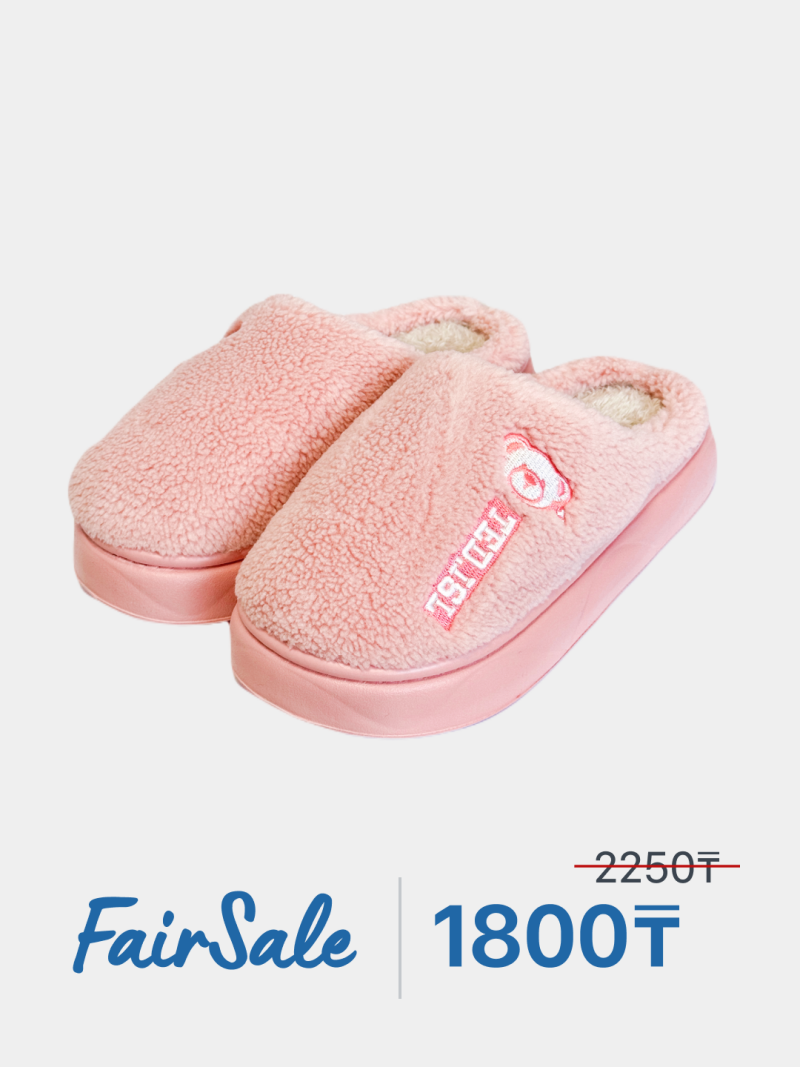 A pair of pink, furry slippers with an embroidered bear and the word "TED.JSL" are displayed with "FairSale" and the price "1800₸" prominently shown.