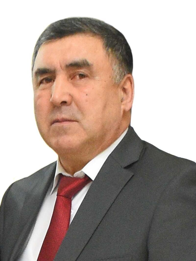 A portrait of a man in a suit and tie.