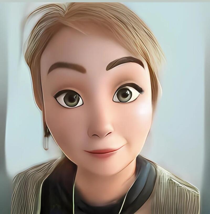 A cartoon-style portrait of a woman with short blonde hair, wearing a grey jacket over a dark top.