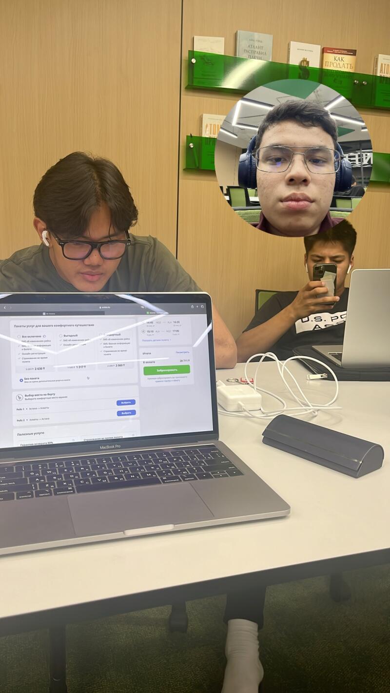 The photo shows three young men working at a table; one is using a laptop that displays travel package options, another is looking at his phone, and a third is shown in a circular inset wearing headphones, and there are books on the shelf in the background.