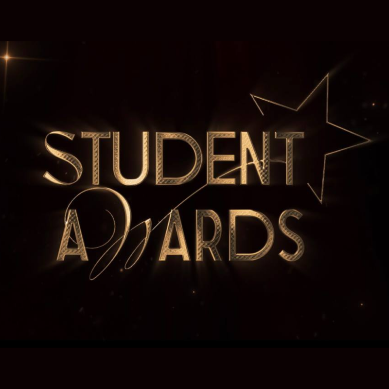 The image displays the text "STUDENT AWARDS" in a golden, stylized font, accompanied by a star outline, set against a dark background.