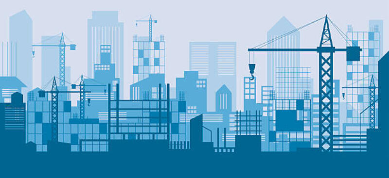 A blue-toned illustration depicts a city skyline under construction, featuring numerous cranes and buildings in various stages of completion.