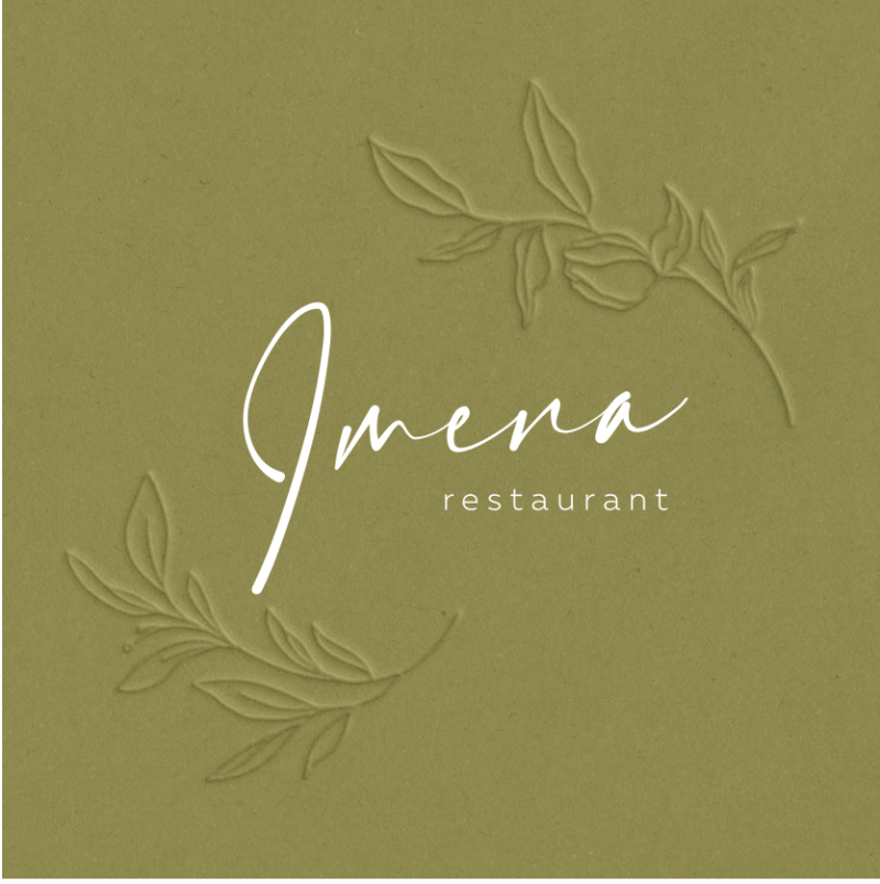 The image features a light-green background with the word "Imena" in white script font, accompanied by the word "restaurant" in smaller, simpler font. Two embossed floral designs are also on the background.