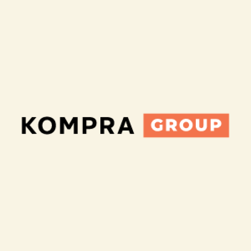 The image features the text "KOMPRA GROUP," with "KOMPRA" in black and "GROUP" in white inside an orange rectangle, set against a light beige background.