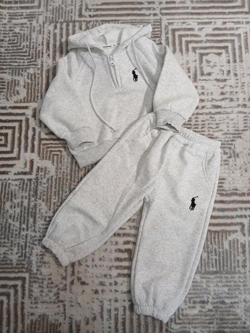 A light gray hoodie and sweatpants set with a black polo player logo on each piece.
