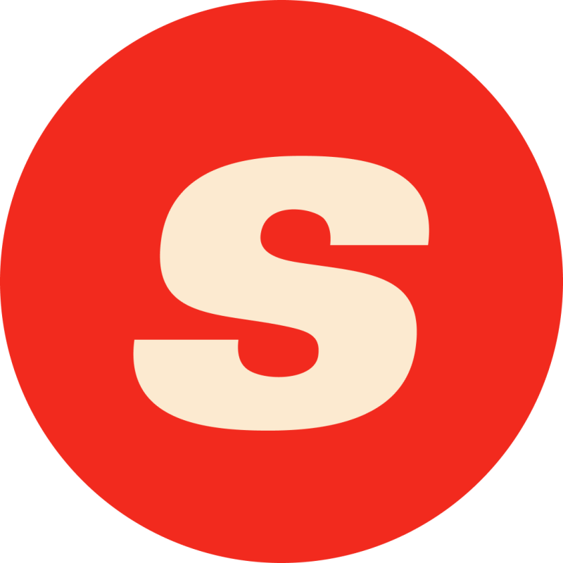 A red circle contains a cream-colored letter 'S'.