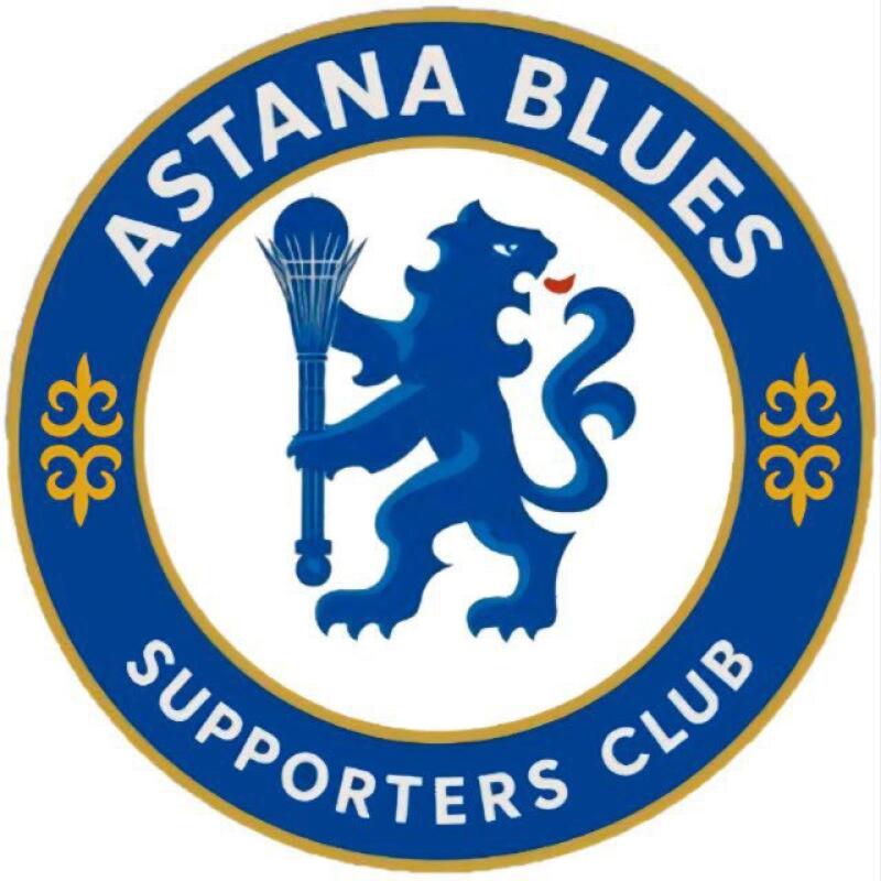 The image is a circular logo with the text "ASTANA BLUES" and "SUPPORTERS CLUB" in blue lettering on a white background; it has a blue lion holding a staff in the center with yellow ornaments on the sides.