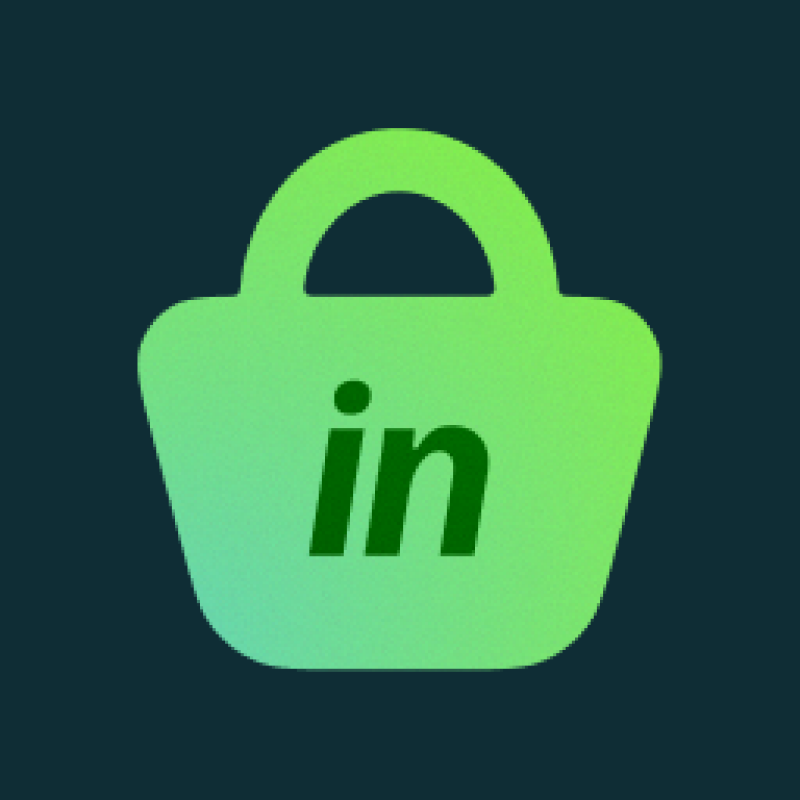 A green shopping bag with the letters 'in' in dark green on a dark blue background.