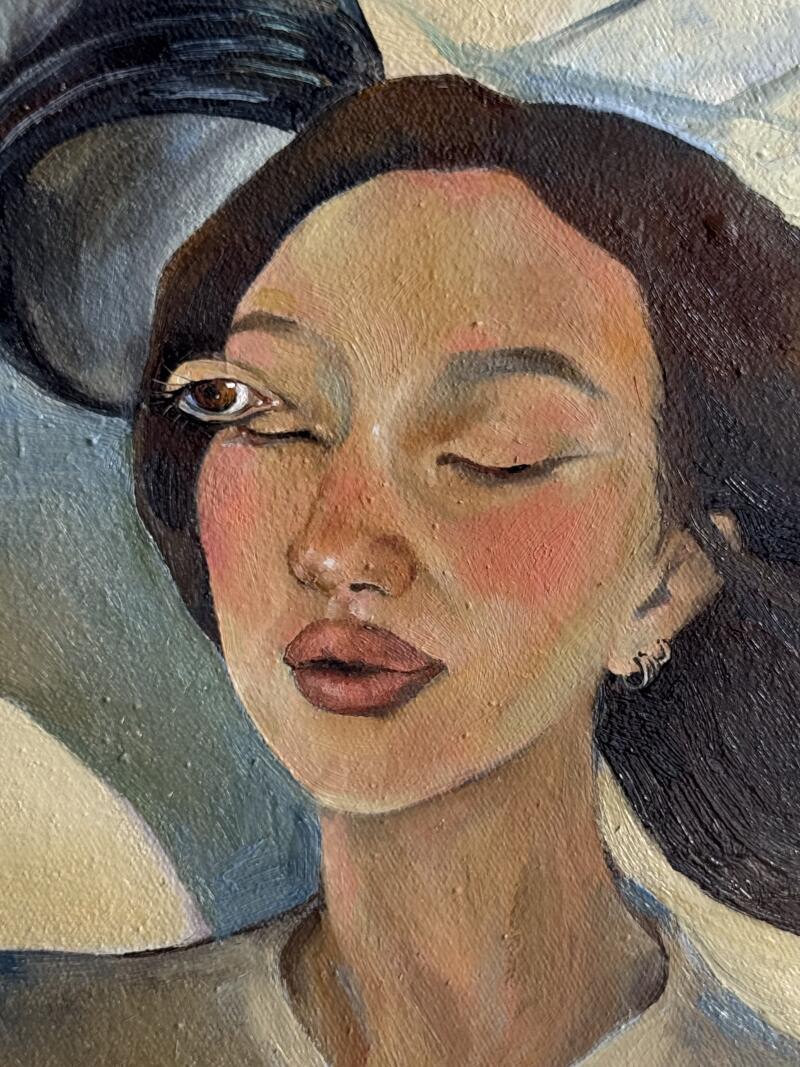 A close-up painting of a woman with dark hair, warm skin, rosy cheeks, and full pinkish lips. Her left eye is open and looking sideways, while her right eye is closed, and she wears a silver hoop earring.