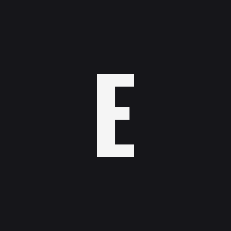 A large white capital letter "E" is displayed on a solid black background.