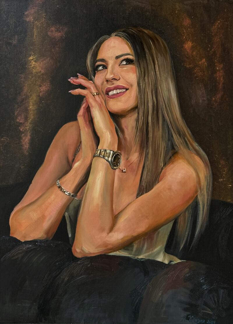 A painting of a woman with long blonde hair, wearing a watch and ring, smiling and looking upwards with her hands near her face.
