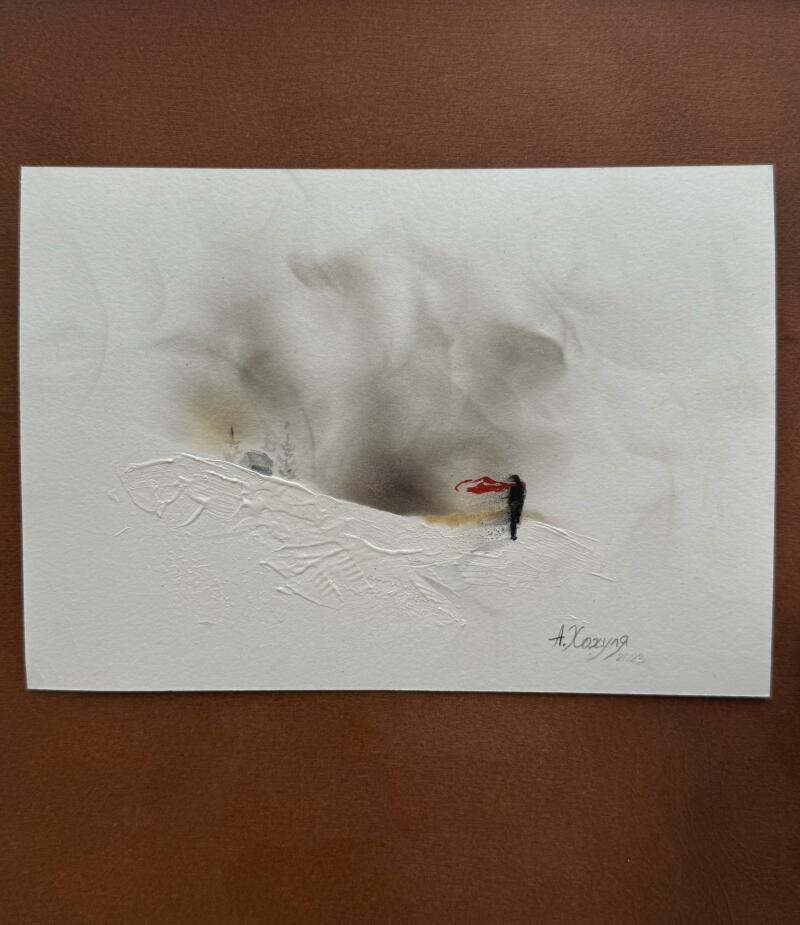 A painting depicts a solitary figure in black with a red scarf standing on a snow-covered ground, against a backdrop of swirling gray and white clouds. The signature 'A. Хохуля' is visible in the lower right corner.