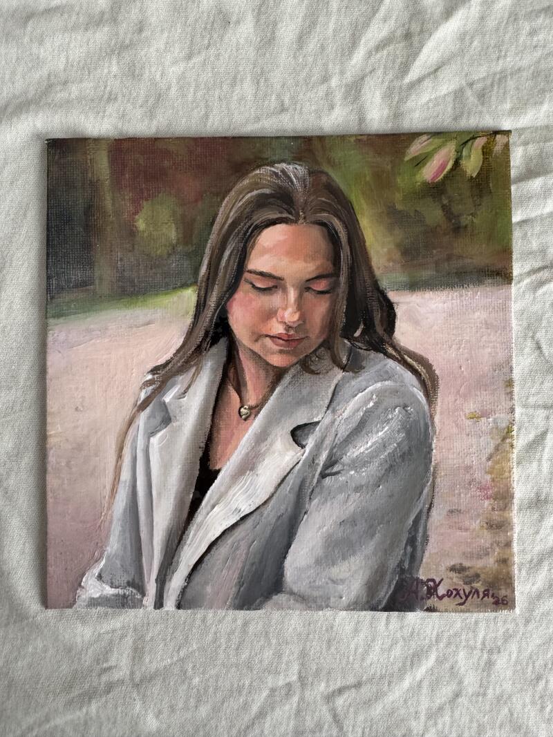 A square oil painting shows a portrait of a woman with long brown hair wearing a gray blazer; the artist's signature is visible in the lower right corner.