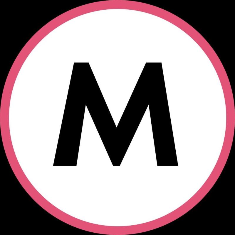 The image shows a black letter "M" inside a white circle with a pink border, set against a black background.