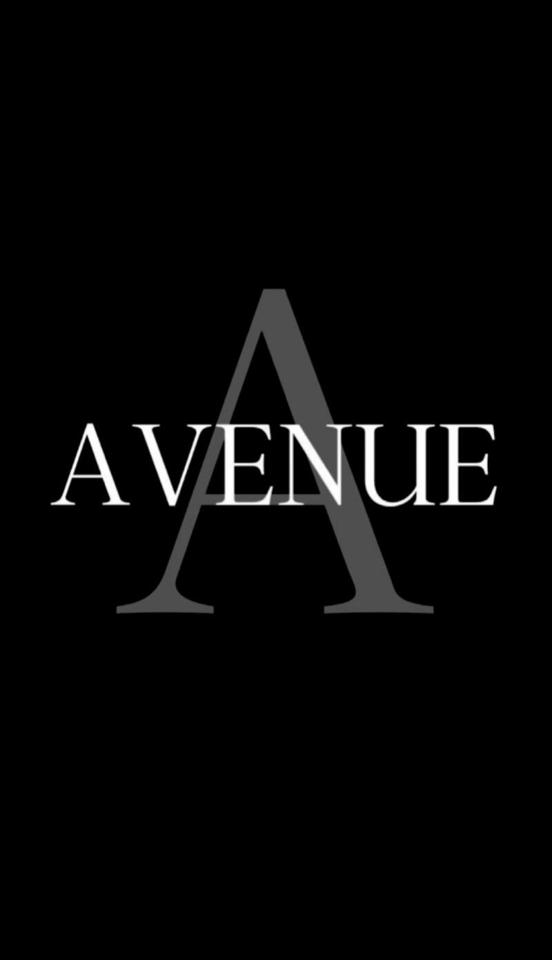 Black background with the white word "AVENUE" partially overlaid by a large, semi-transparent grey letter "A".