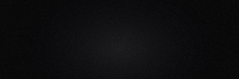 A solid black background with a subtle, dark textured pattern visible.