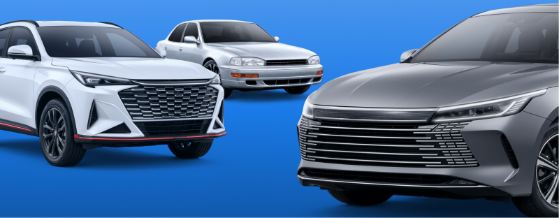 Three cars, including a white SUV, a silver sedan, and a grey modern car, are displayed from the front against a solid blue background.