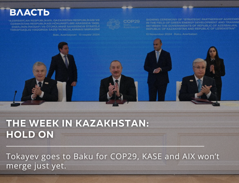 The photo shows four men in suits sitting at a table, clapping, with a blue background displaying text in Azerbaijani and English; the lower part of the image has white text that reads "THE WEEK IN KAZAKHSTAN: HOLD ON, Tokayev goes to Baku for COP29, KASE and AIX won't merge just yet." and the word "ВЛАСТЬ" at the top left.